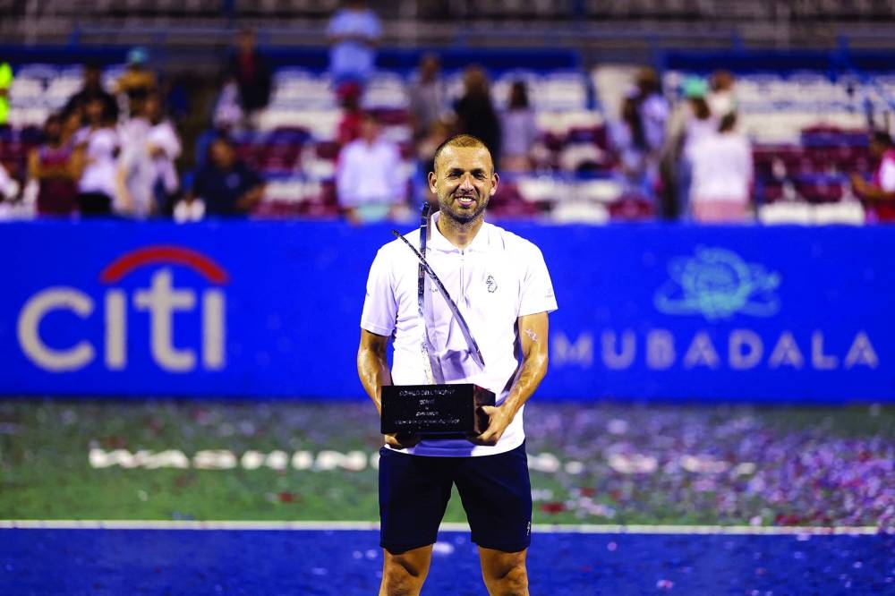 
Daniel Evans of Great Britain poses with the trophy after defeating Tallon Griekspoor of the Netherlands in the singles final of the Washington Open. (AFP) 