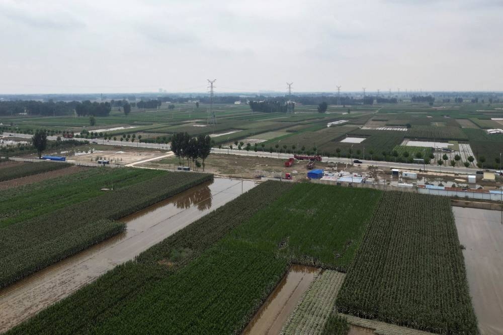 An aerial view shows flood-affected farmlands after the rains and floods brought by remnants of Typhoon Doksuri, in Zhuozhou, Hebei province, China. REUTERS/Josh Arslan/File Photo