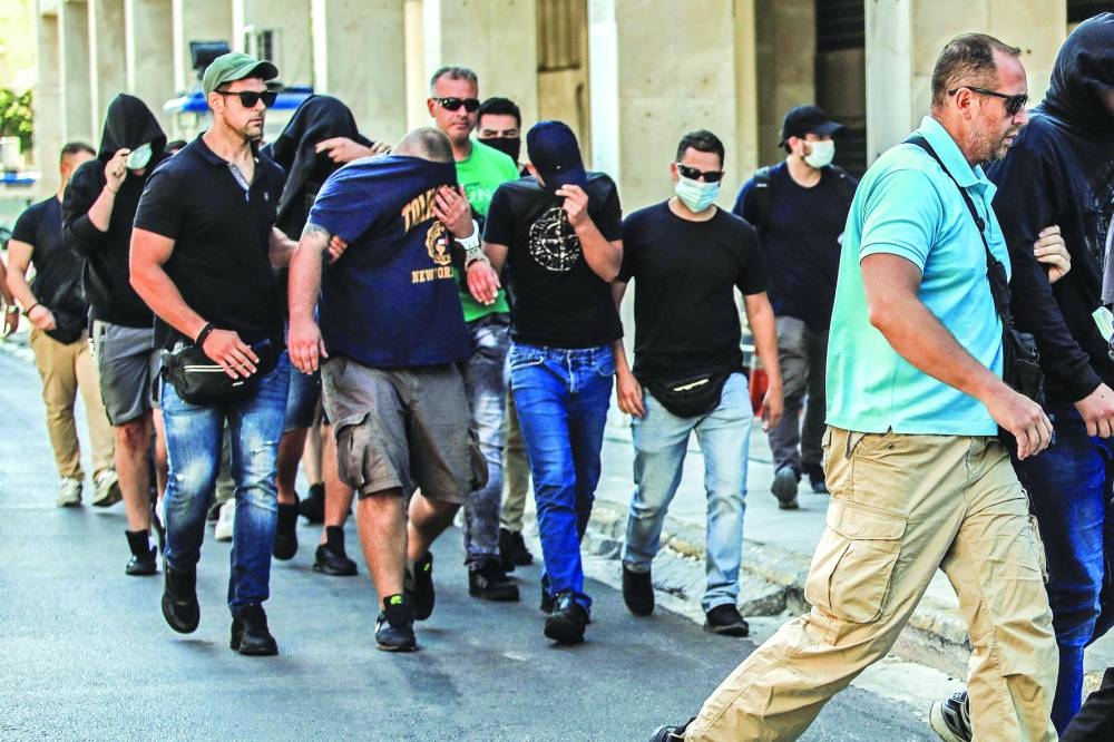 More than 100 people, mostly Croatians, appeared before Greek prosecutors on Wednesday in connection with a deadly mass brawl near 
Athens before match between AEK Athens and Dinamo Zagreb. (AFP)