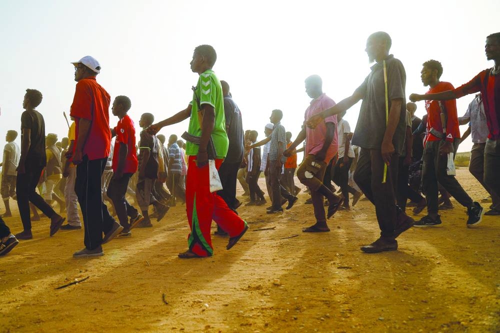 
Civilians recruited by the Sudanese army take part in a military training in the Kassinger area of Sudan’s Northern State. 