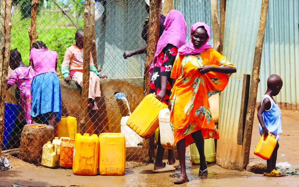
Refugees collect water from a tap at the Gorom Refugee camp near Juba, in South Sudan. 