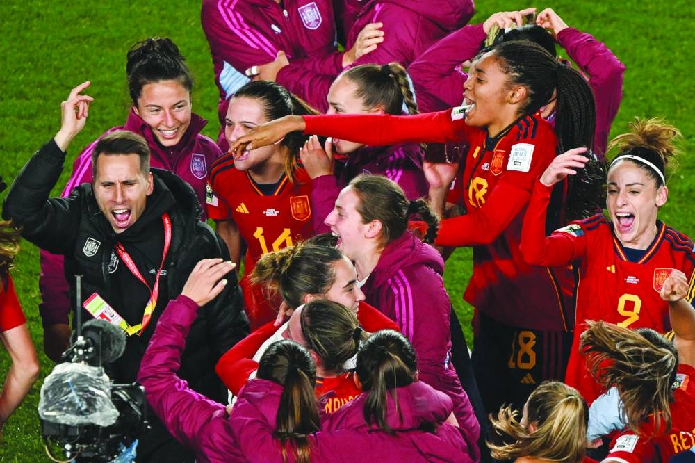 Spain's players celebrate their win in the Australia and New Zealand 2023 Women's World Cup semi-final football match between Spain and Sweden at Eden Park in Auckland on Tuesday. (AFP)