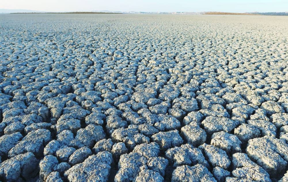 Cracked ground is seen at a dried-out part of the Sijoumi lagoon.