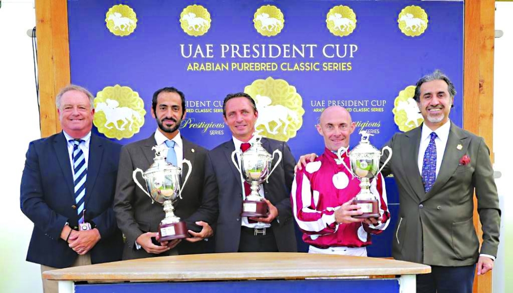 
Connections of Al Doha pose with the trophies after the filly won the Gr 1 (PA) UAE President Cup - UK Arabian Derby - at Doncaster. 