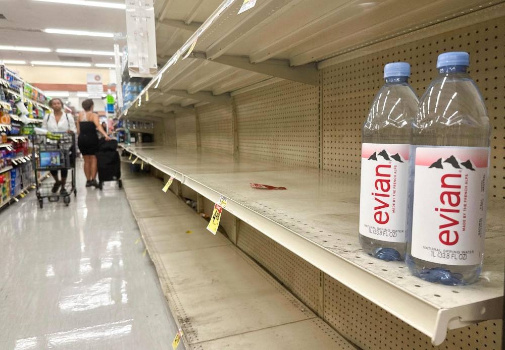 
Shelves are nearly empty of bottled water in a grocery store in Los Angeles as Hurricane Hilary approaches. 