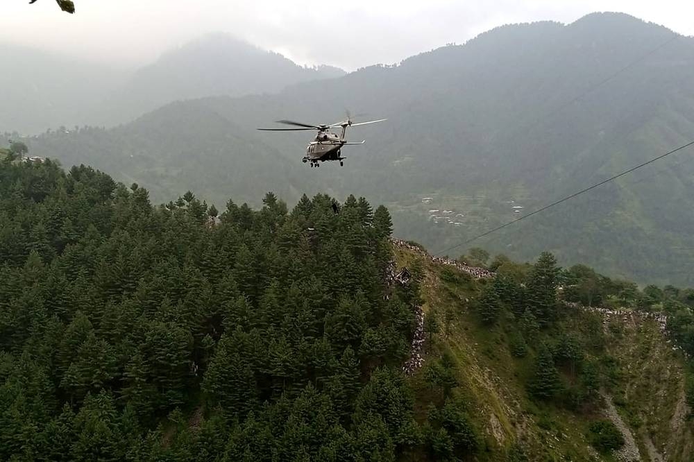 A military helicopter conducts a rescue operation to recover students stuck in a chairlift in the Pashto village of mountainous Khyber Pakhtunkhwa province. AFP