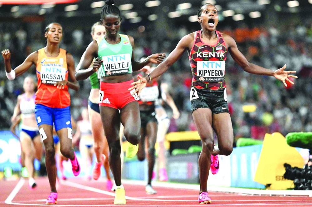 
Kenya’s Faith Kipyegon (right) celebrates winning the 1500m final during the World Athletics Championships in Budapest. (AFP) 