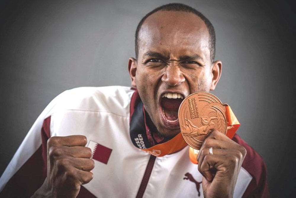 Men's high jump bronze-medallist Qatar's Mutaz Essa Barshim poses for portraits during a studio photo session on the sidelines of the World Athletics Championships at the National Athletics Centre in Budapest on Wednesday. (AFP)