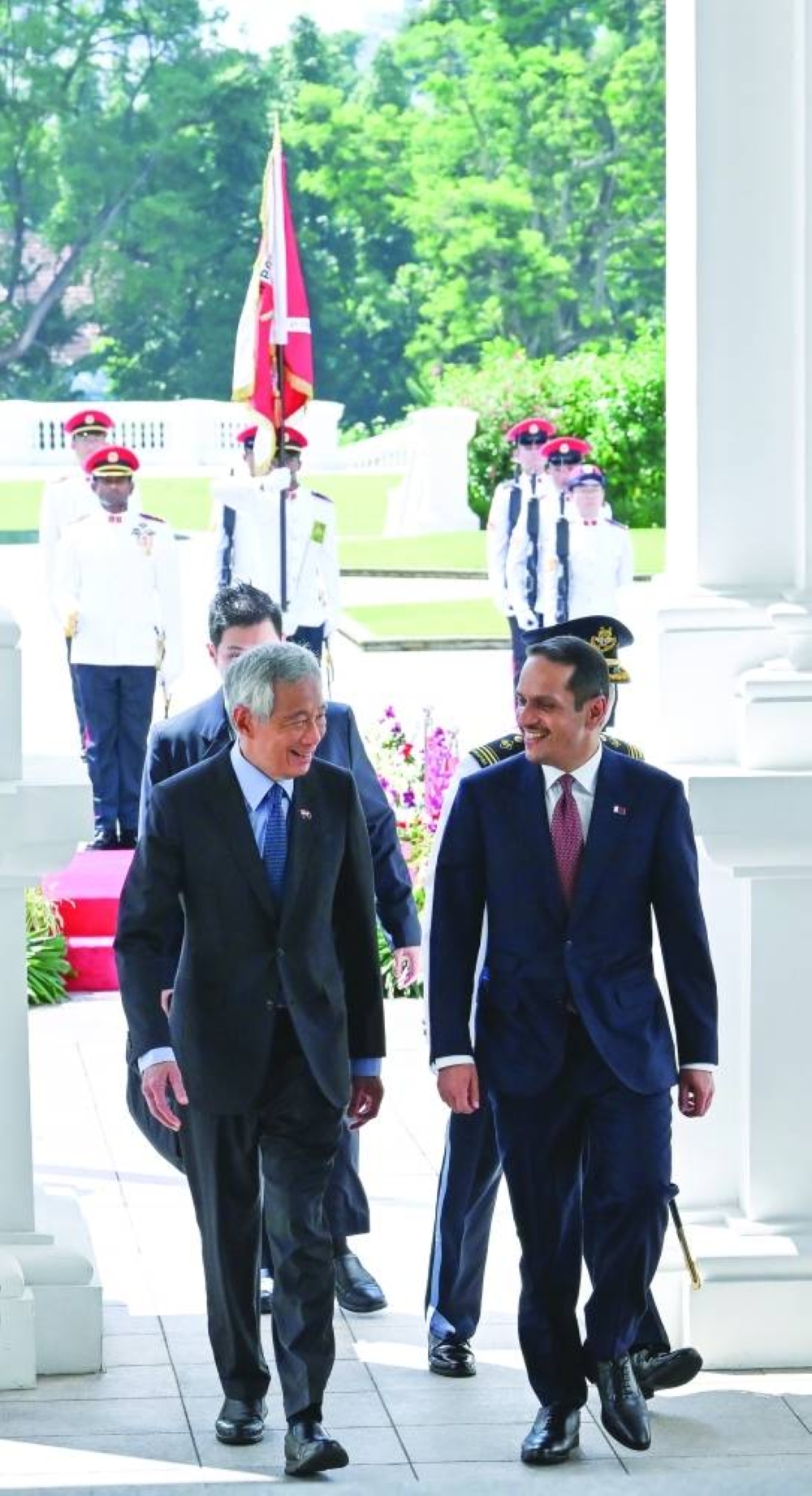 HE the Prime Minister and Minister of Foreign Affairs Sheikh Mohamed bin Abdulrahman bin Jassim al-Thani is welcomed by Singaporean Prime Minister Lee Hsien Loong at the Istana presidential palace in Singapore.