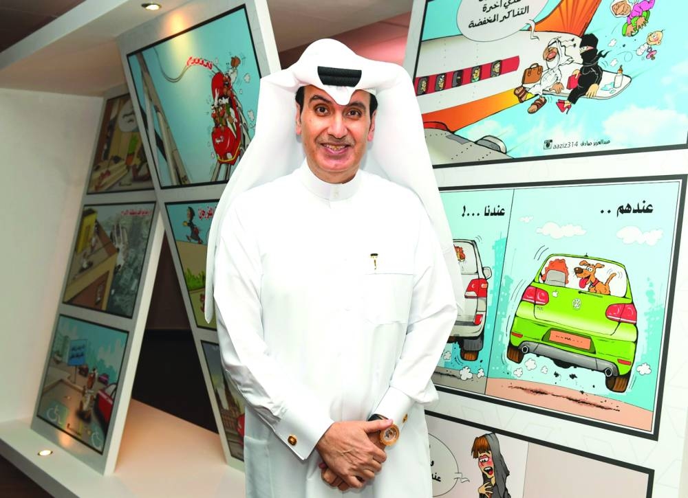 Artist Abdulaziz Sadiq with some of his works featured in the exhibition. PICTURES: Noushad Thekkayil