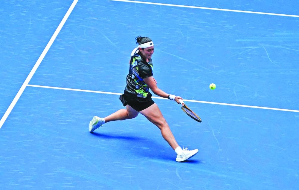 Tunisia’s Ons Jabeur hits forehand return to Colombia’s Camila Osorio during the US Open first round match in New York on Tuesday. (AFP)