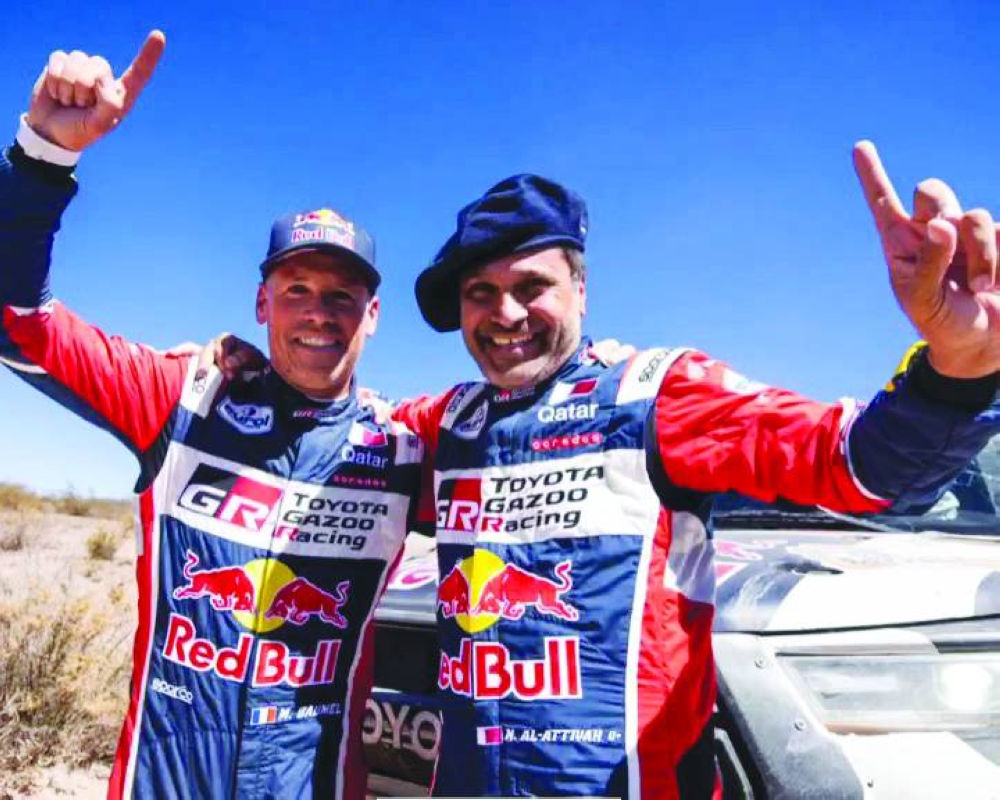Qatar’s racing legend Nasser al-Attiyah (right) and his co-driver Mathieu Baumel.