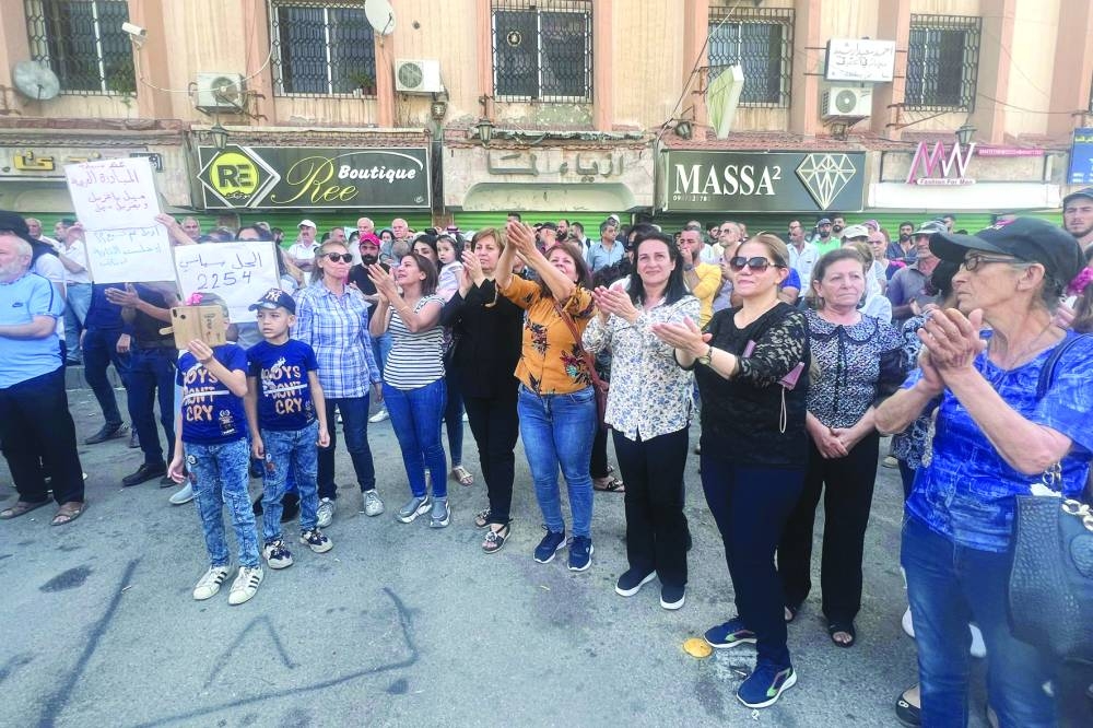 
People protest in the Syria’s southern city of Sweida, yesterday. 