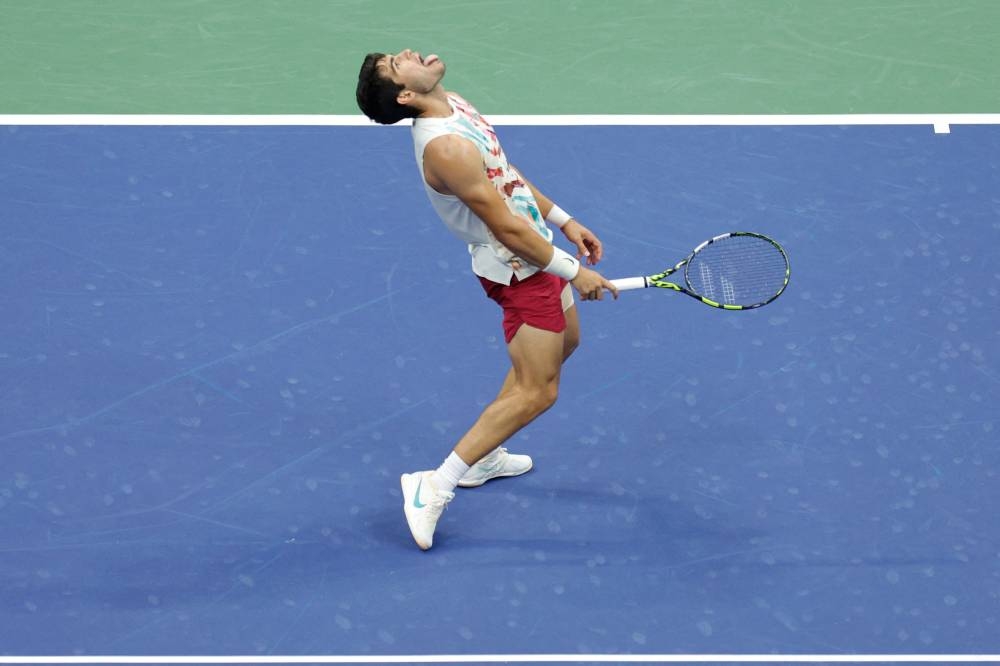 Spain's Carlos Alcaraz reacts after defeated Italy's Matteo Arnaldi during the US Open tennis tournament men's singles round of 16 match at the USTA Billie Jean King National Tennis Center in New York City, on September 4, 2023. (Photo by kena betancur / AFP)