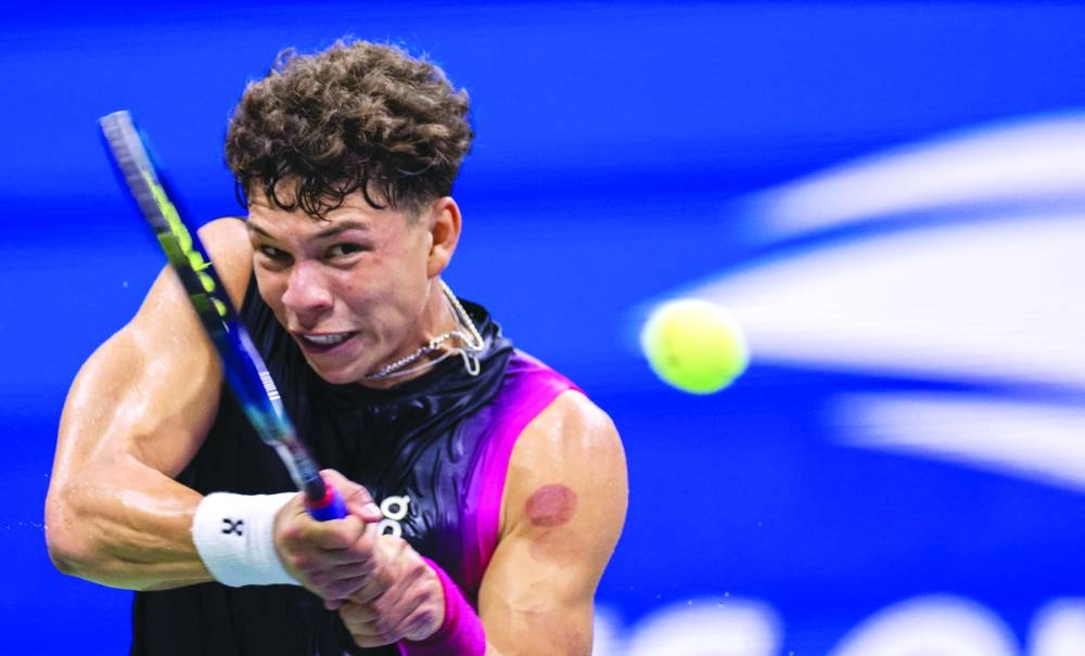Ben Shelton of the US returns the ball to compatriot Frances Tiafoe during the US Open quarter-finals on Wednesday. (AFP)