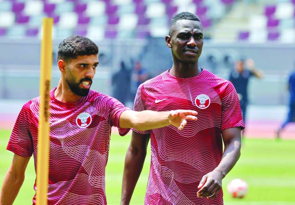 Qatar’s Hassan al-Haydos (left) and Almoez Ali at a training session on Wednesday.