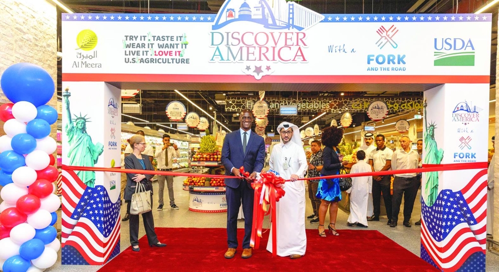 US ambassador Timmy Davis and Al Meera CEO Yousef al-Obaidan leading the ribbon-cutting ceremony.