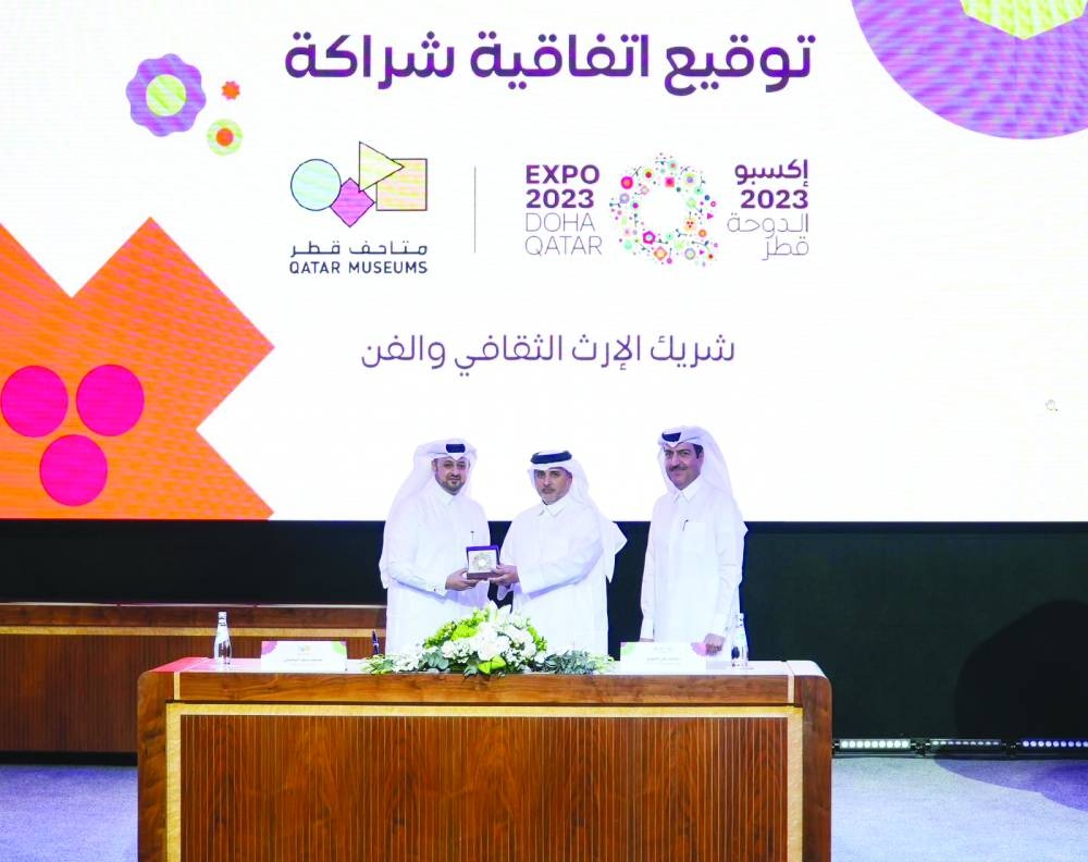 HE Dr Abdullah bin Abdulaziz bin Turki al-Subaie is flanked by Mohamed Saad al-Rumaihi and Mohammed al-Khouri at the signing ceremony on Monday.