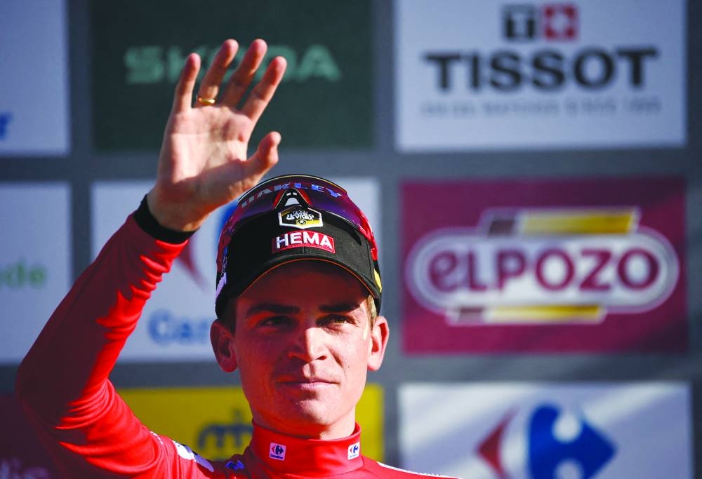 Team Jumbo-Visma’s US rider Sepp Kuss wearing the overall leader’s red jersey celebrates on the podium after stage 18 of the 2023 La Vuelta cycling tour of Spain, a 178.9km race between Pola de Allande and Puerto de La Cruz de Linares, on Thursday. (AFP)