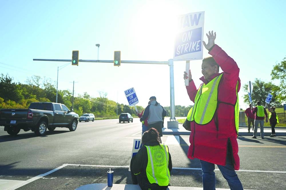 
GM workers with the UAW Local 2250 Union strike outside the General Motors Wentzville Assembly Plant in Wentzville, Missouri. 