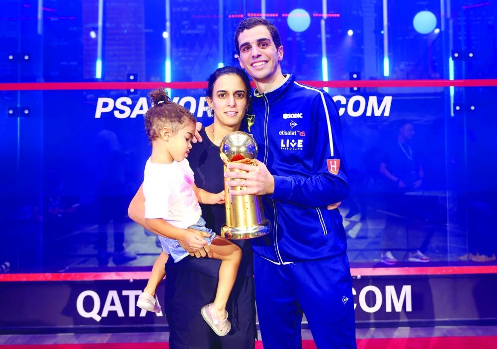 Ali Farag is all smiles as he poses with his wife and women’s World No 8 Nour El Tayeb and daughter after his victory on Saturday.