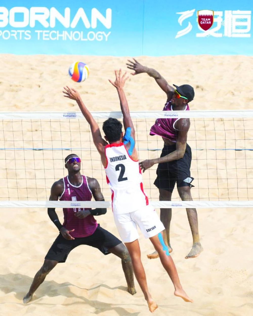 Qatar’s Cherif Younousse and Ahmed Tijan in action against Indonesia’s Danangsyah Pribadi and Sofyan Rachman Efendi in their Asian Games beach volleyball Pool B game in Hangzhou, China, on Wednesday.