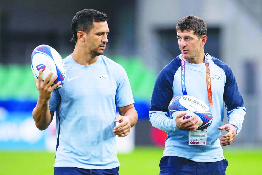 Argentina’s centre Matias Moroni (left) and scrum-half Tomas Cubelli speak while holding a ball during the captain’s run training session at Stade Geoffroy-Guichard in Saint-Etienne, France, on Thursday. (AFP)