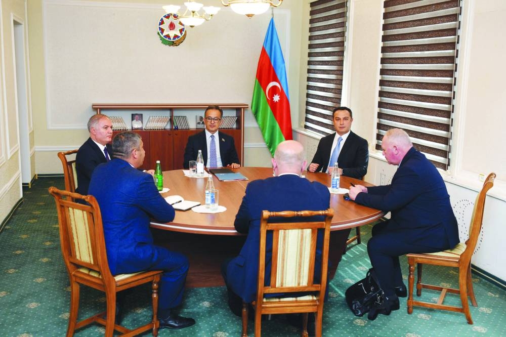 Azerbaijani delegation lead by Deputy of the Azerbaijani Parliament Ramin Mammadov (centre) attends talks with Karabakh delegation in the Azerbaijani town of Yevlakh on Thursday. (AFP)