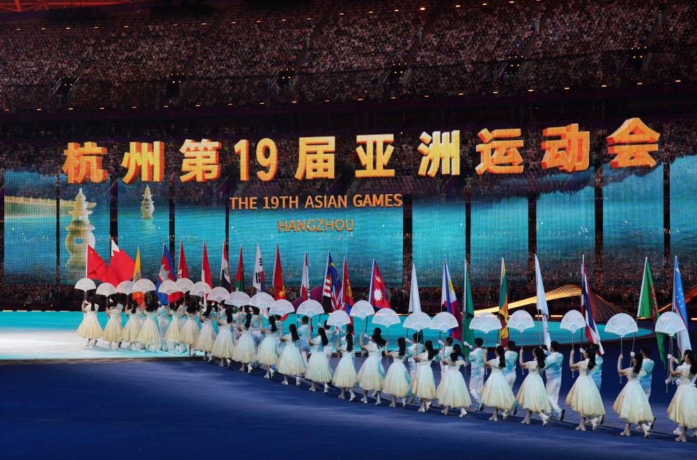 The flags of participating countries are carried into the stadium during the Opening Ceremony REUTERS
