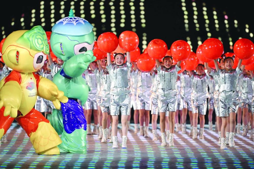 Performers take part in the opening ceremony of the 2022 Asian Games at the Hangzhou Olympic Sports Centre Stadium in Hangzhou in China's eastern Zhejiang province on Saturday. (AFP)