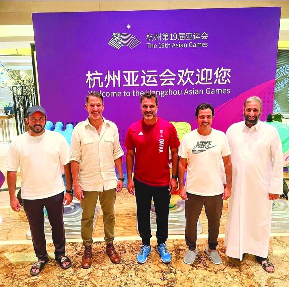 
Qatar’s shooter Nasser Saleh al-Attiyah (centre), Qatar Shooting & Archery Association President Mishaal Ibrahim al-Nasr (second left) and other officials pose in Hangzhou. 