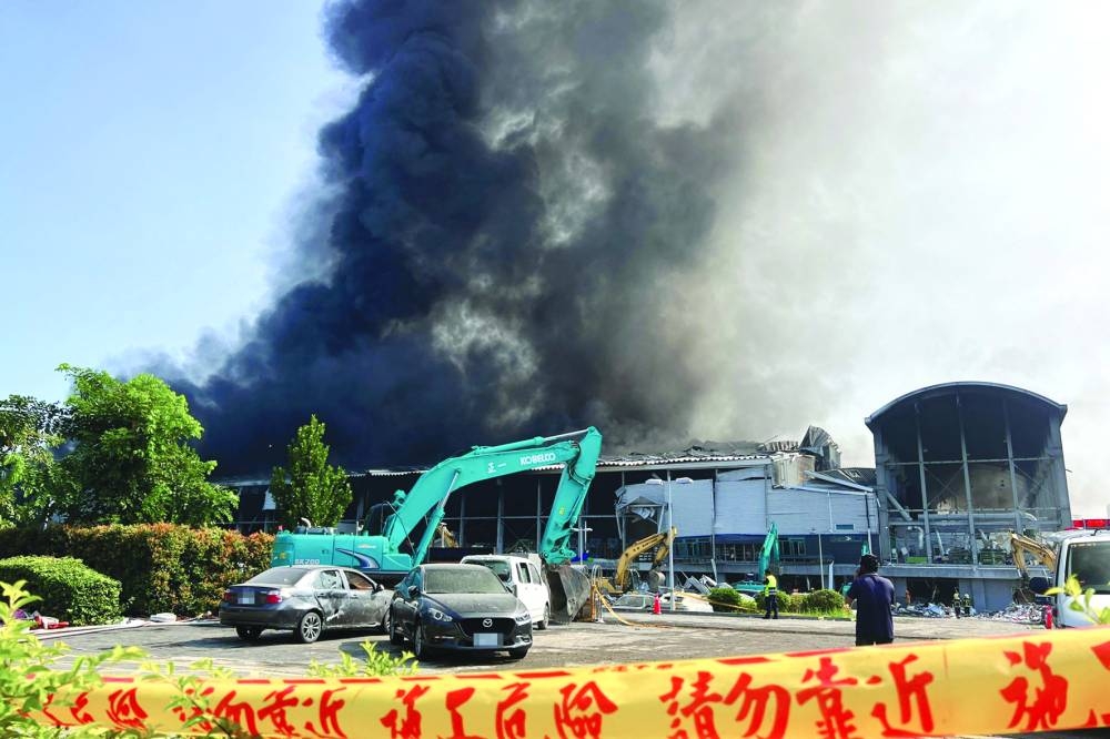 
Smoke billowing from a factory after a fire in Pingtung, southern Taiwan. 