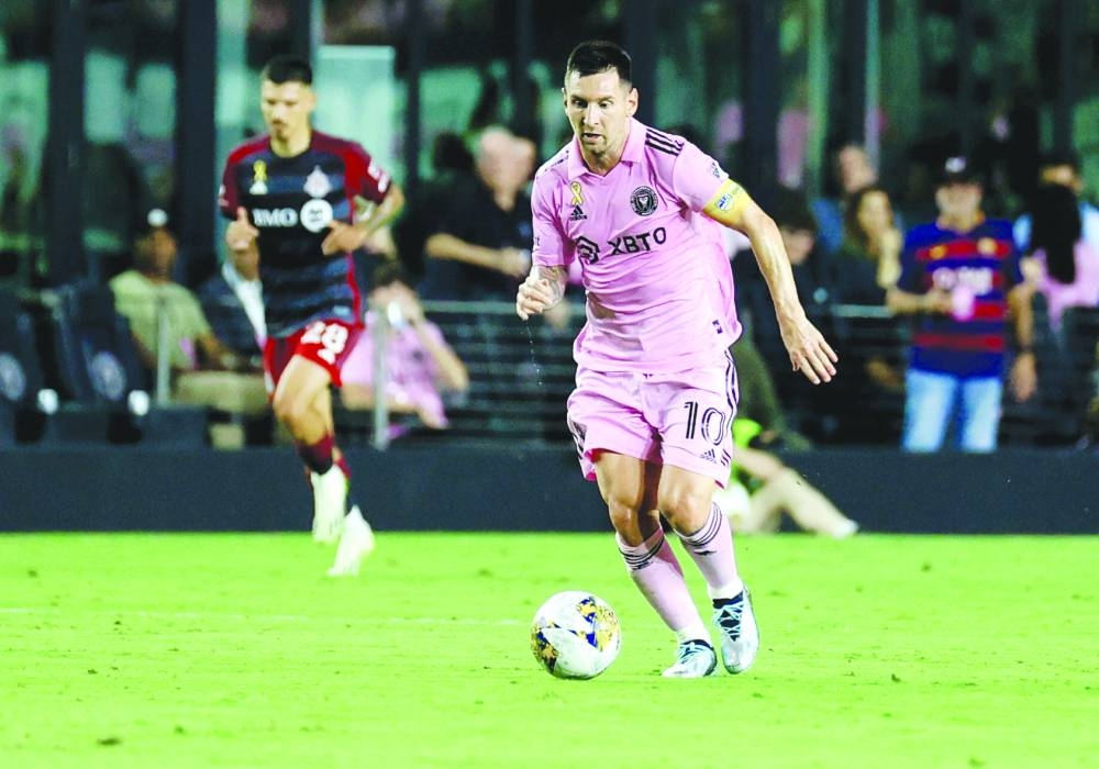 Inter Miami’s Argentine forward Lionel Messi runs with the ball during the Major League Soccer match against Toronto FC at DRV PNK Stadium in Fort Lauderdale, Florida, on September 20, 2023. Messi remains an injury doubt for Inter Miami’s US Open Cup final against Houston Dynamo today with a decision on his involvement to be made at the “last minute,” coach Gerardo Martino  said on Tuesday. (AFP)