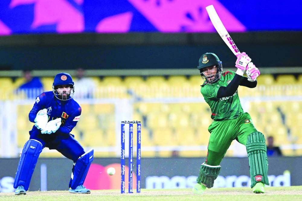 Bangladesh’s Mushfiqur Rahim (right) plays a shot during a warm-up match against Sri Lanka in Guwahati on Friday. (AFP)
