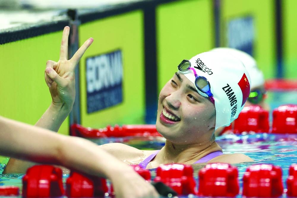 
China’s Zhang Yufei reacts after winning the women’s 50m Butterfly gold. (Reuters) 
