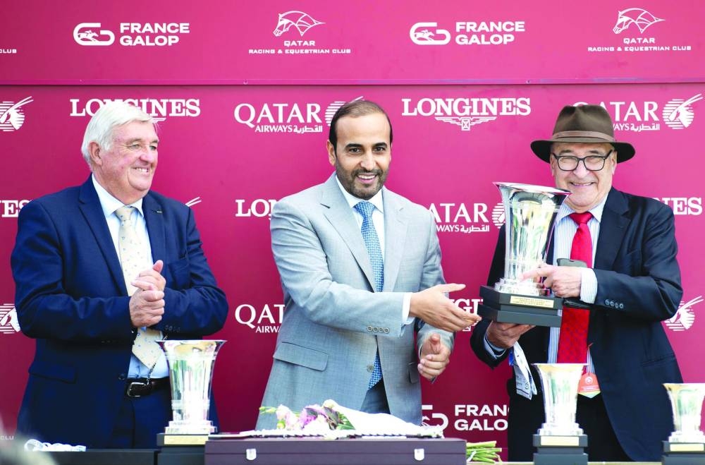 
QREC chairman Issa bin Mohamed al-Mohannadi with the connections of Sea Silk Road, which won the Group 1 Qatar Prix de Royallieu. 
