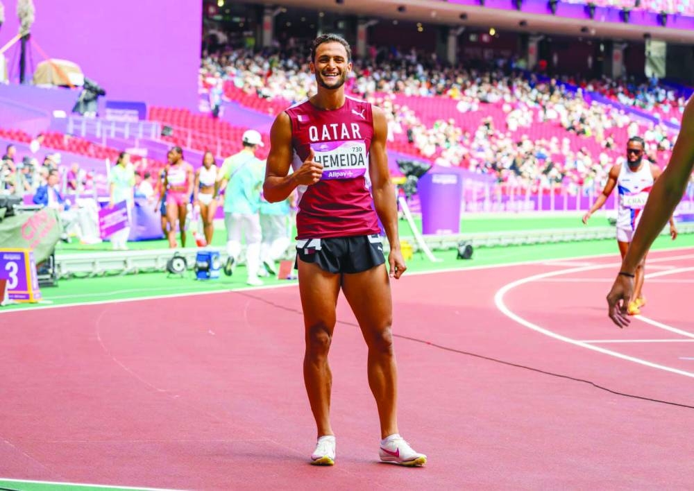 
Bassem Hemeida celebrates after qualifying for the 400m hurdles final. 