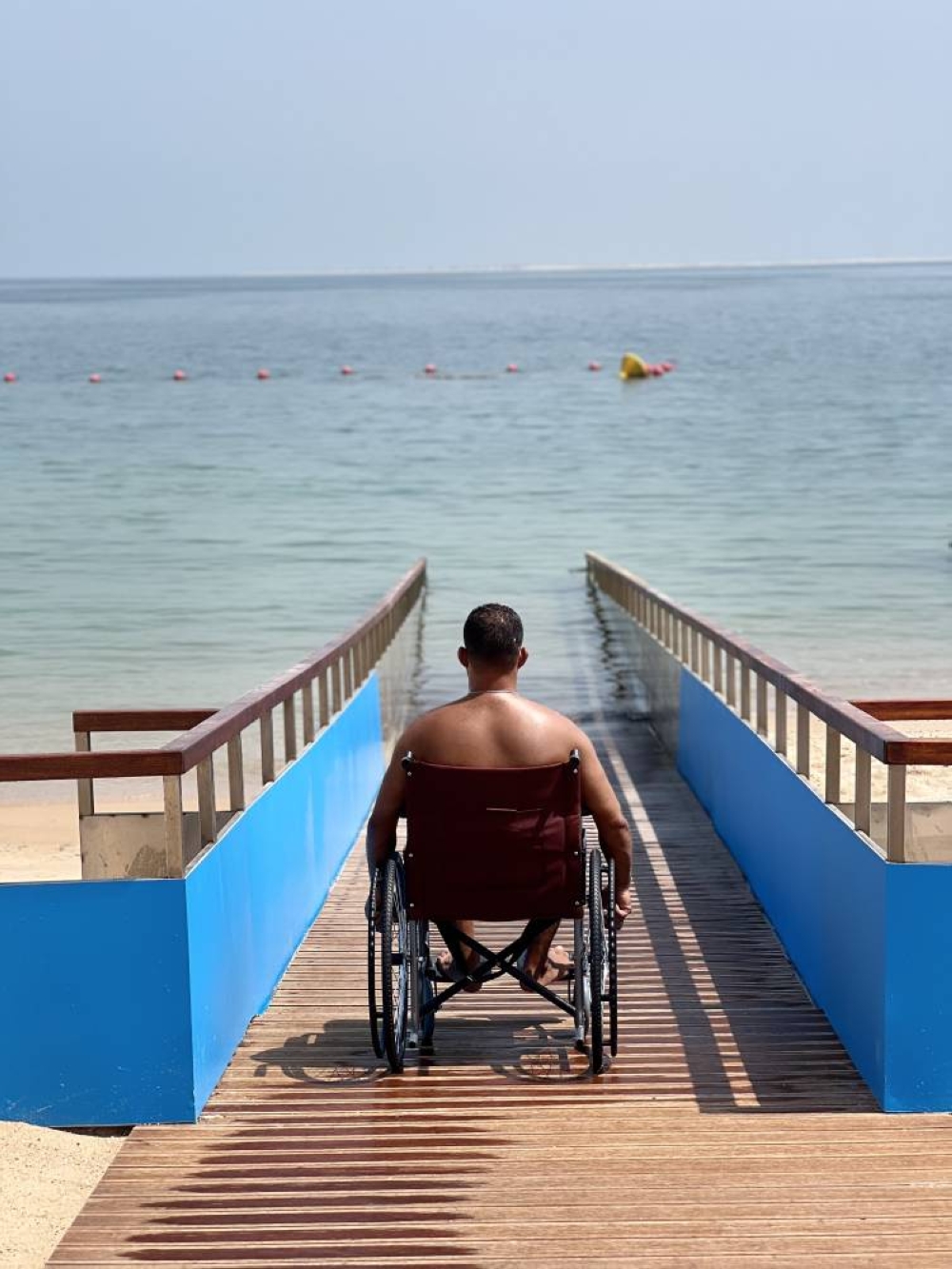 The ramp at WBB includes a structure that allows individuals using wheelchairs to navigate the sandy terrain and access the waterfront easily.