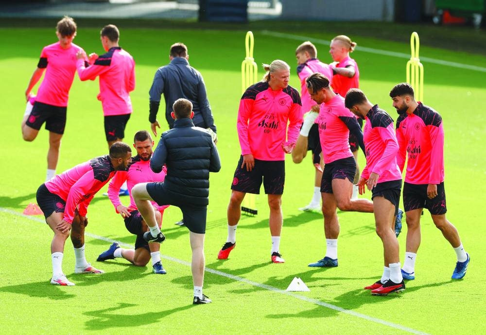 Manchester City’s Erling Haaland with teammates during a tarining session on Tuesday. (Reuters)