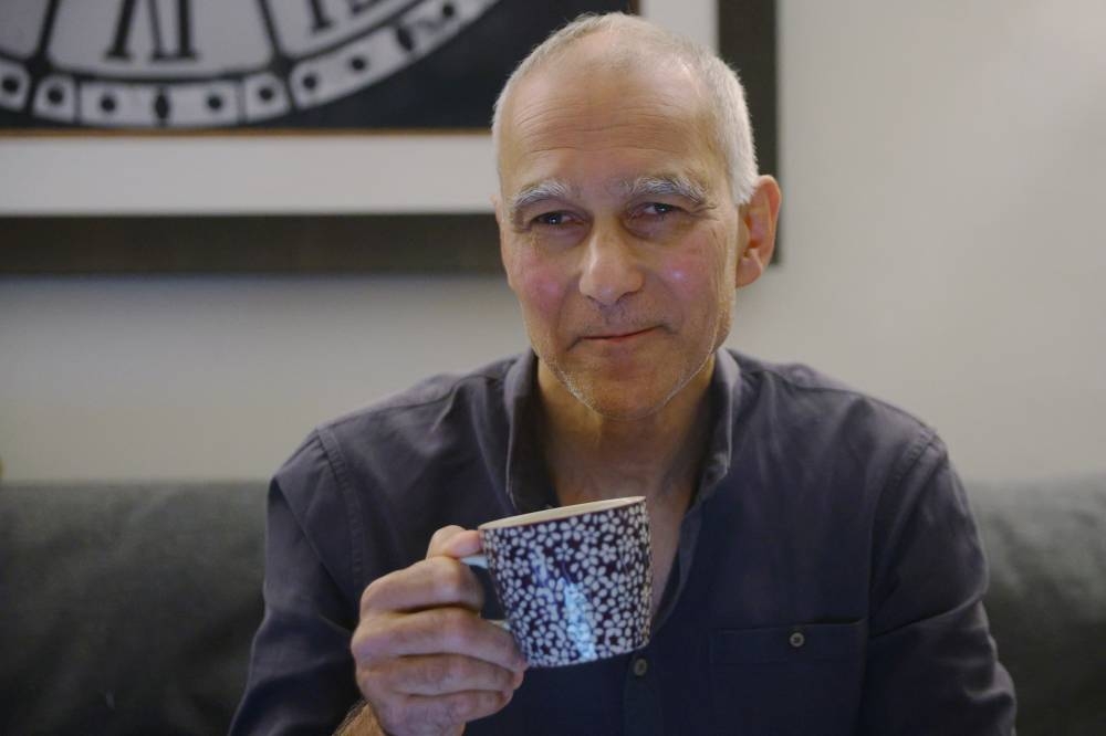 Moungi Bawendi, a professor at the Massachusetts Institute of Technology (MIT), drinks coffee at home after winning the 2023 Nobel Prize in Chemistry, in Cambridge, Massachusetts, US.   REUTERS