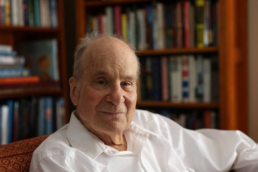 Columbia University professor emeritus Louis E. Brus poses at his home after being named a co-winner of the Nobel Prize for Chemistry, in Hastings On Hudson, New York, US. REUTERS