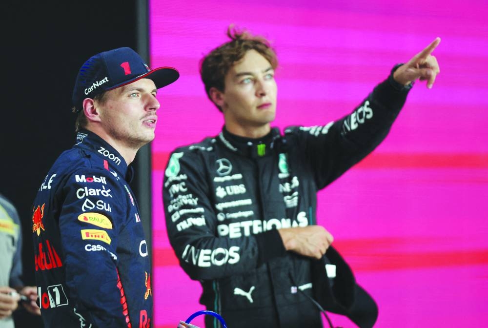 Pole-sitter Max Verstappen (left) of Red Bull with Mercedes' George Russell, who finished second in the qualifying, during the Formula One Qatar Grand Prix at the Lusail International Circuit on Friday.
