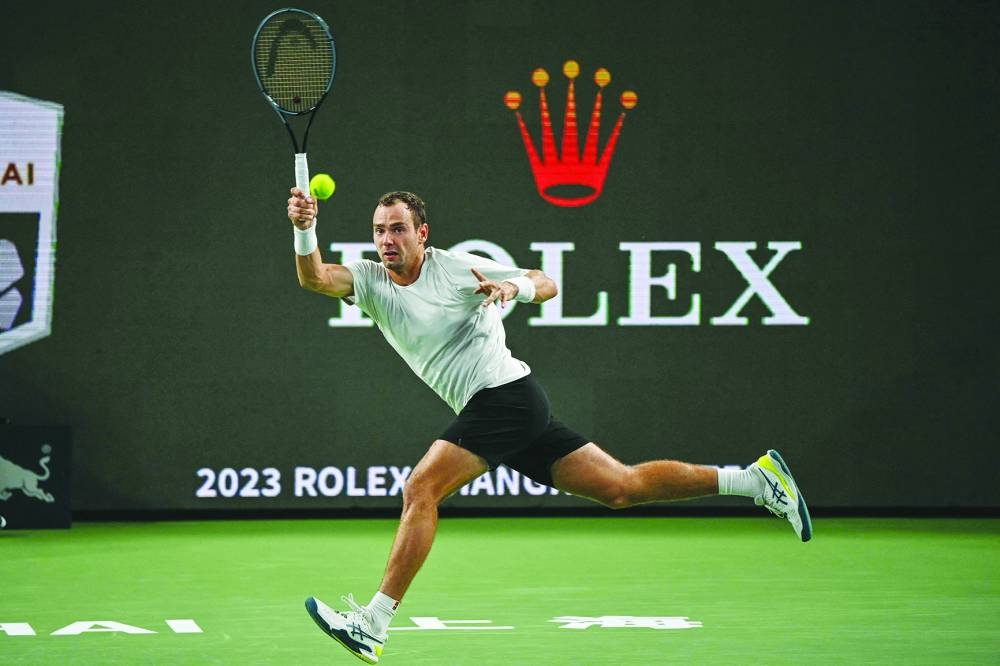 Roman Safiullin of Russia hits a return to Alexander Zverev of Germany during their men's singles match at the Shanghai Masters tennis tournament in Shanghai on Friday. ( AFP)