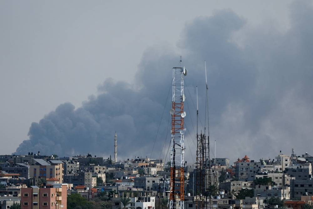 Smoke rises following Israeli strikes in Gaza Saturday. REUTERS