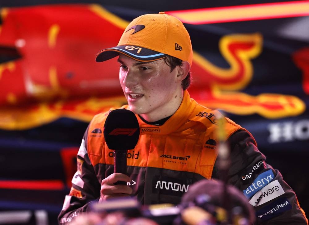 McLaren's Oscar Piastri celebrates after winning the sprint race. REUTERS