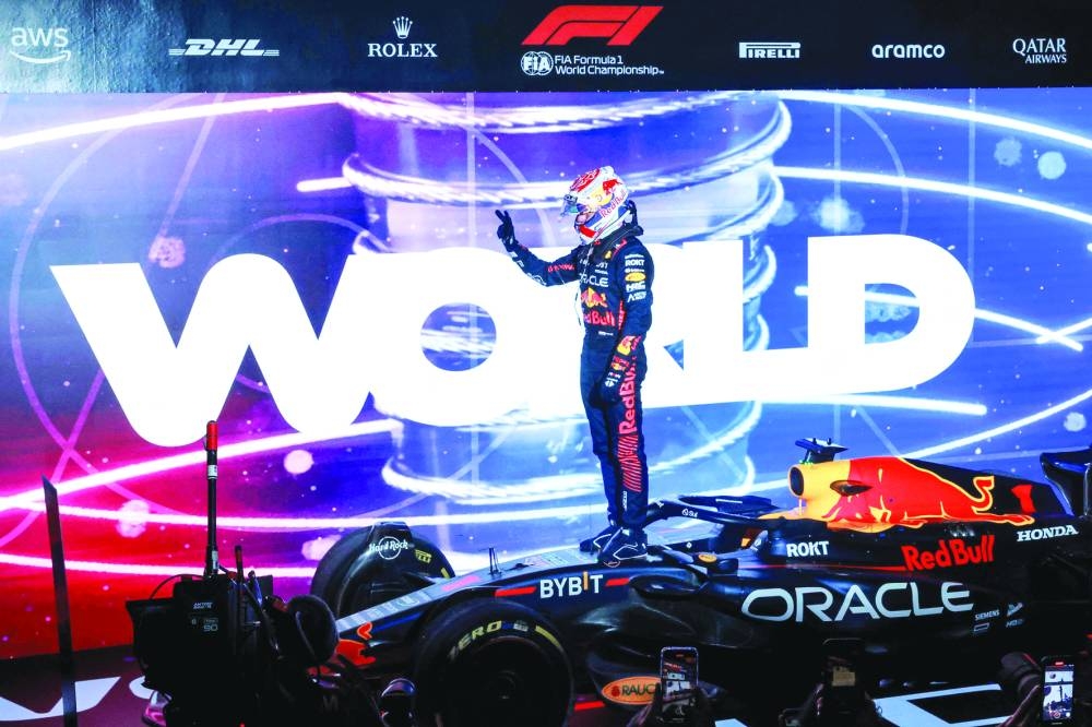 Red Bull Racing's Dutch driver Max Verstappen celebrates winning his third world title after the sprint race ahead of the Qatari Formula One Grand Prix at the Lusail International Circuit on Saturday. (AFP)