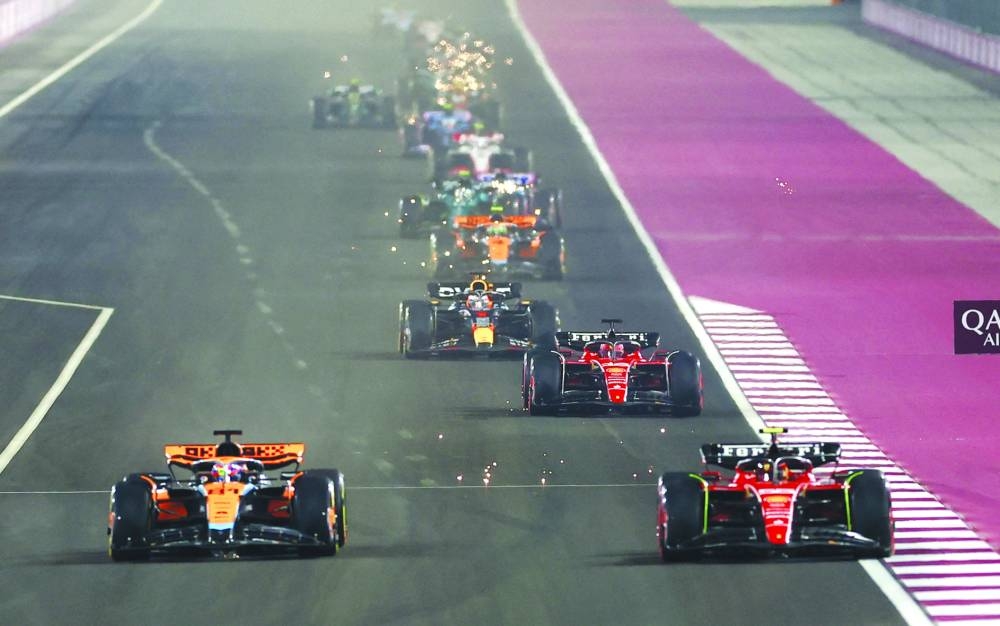 McLaren's Oscar Piastri and Ferrari's Carlos Sainz Jr. in action during the sprint race