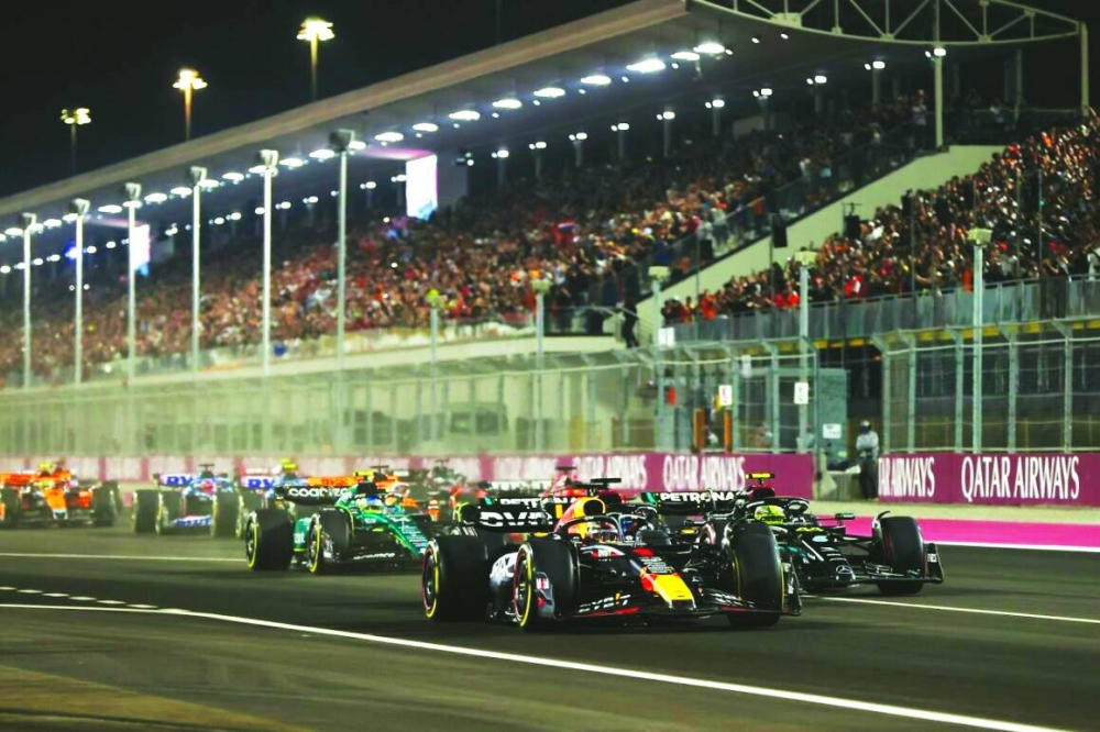 Max Verstappen, Red Bull Racing RB19, leads Sir Lewis Hamilton, Mercedes F1 W14, Fernando Alonso, Aston Martin AMR23, Charles Leclerc, Ferrari SF-23, and the rest of the field at the start