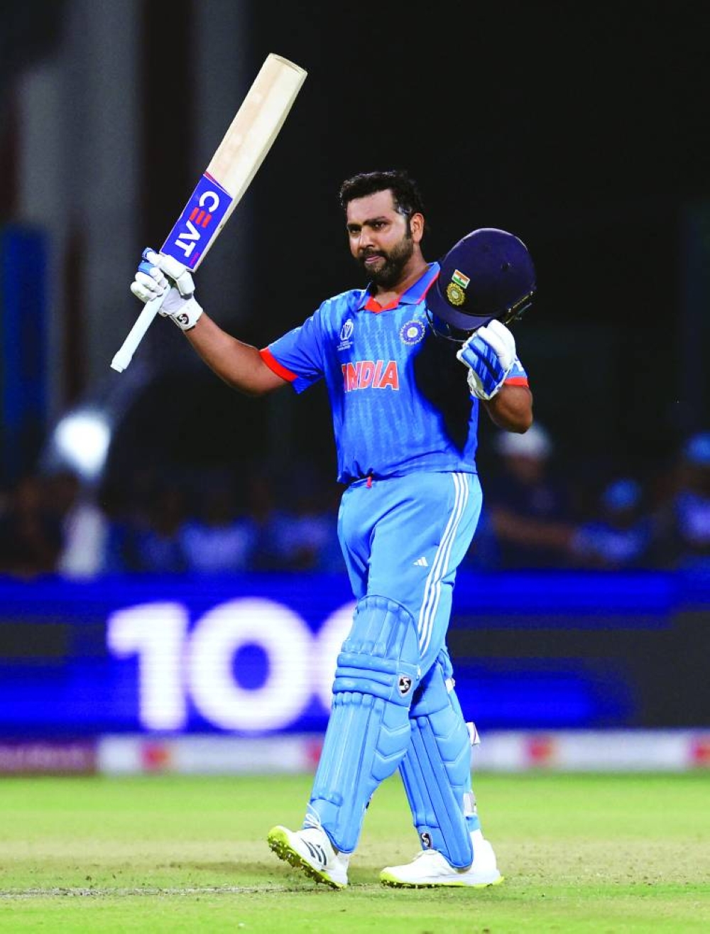 India’s Rohit Sharma celebrates after reaching his century during World Cup match against Afghanistan in New Delhi on Wednesday. (Reuters)