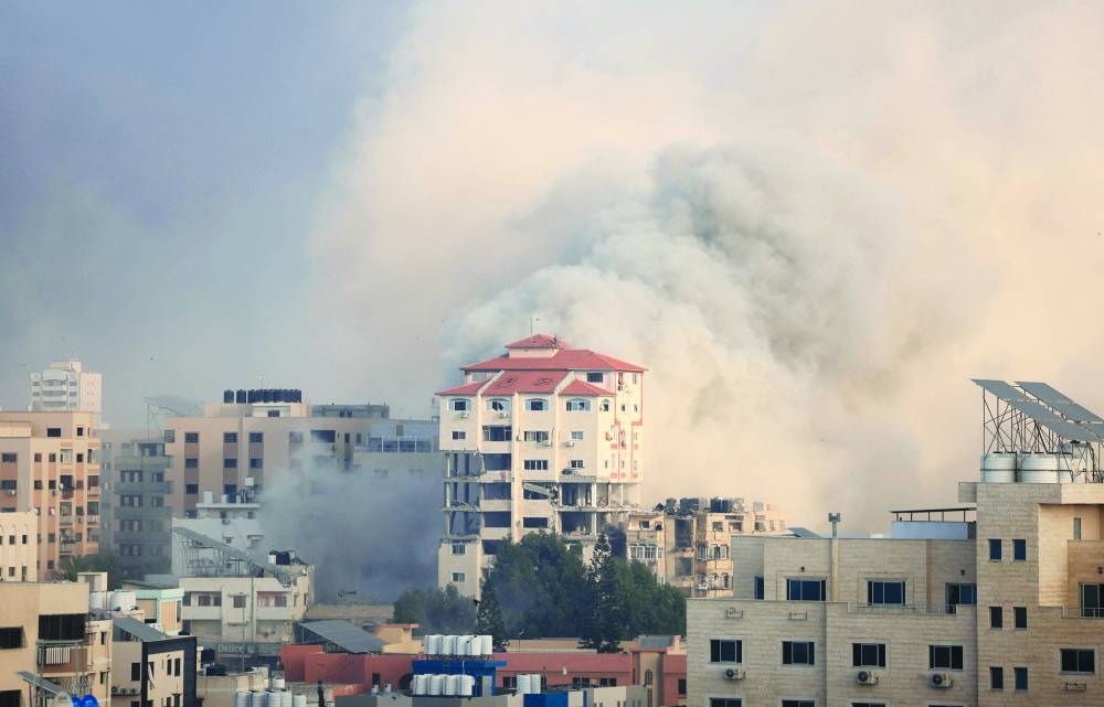 
Smoke plumes billow following Israeli bombardment in Gaza City, yesterday, on the fifth day of fighting between Israel and the Hamas. 